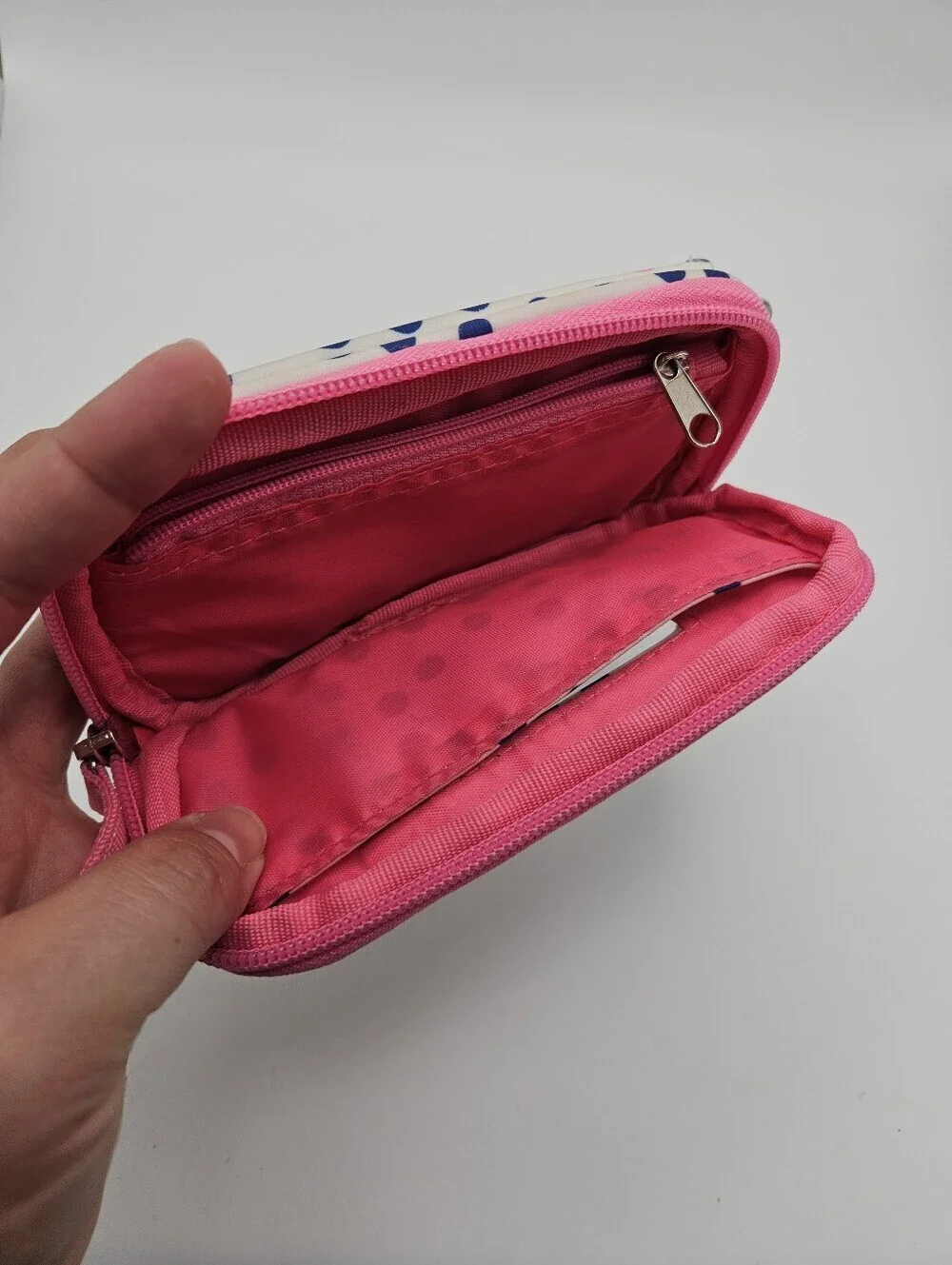 Scout white wristlet with blue polka dots and pin accents